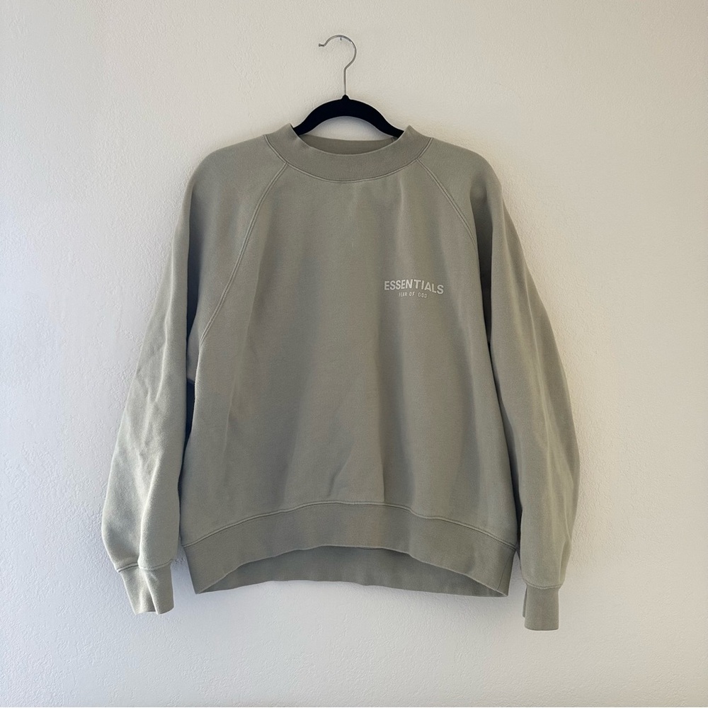 Fear of God Essentials 
Pistachio green crewneck